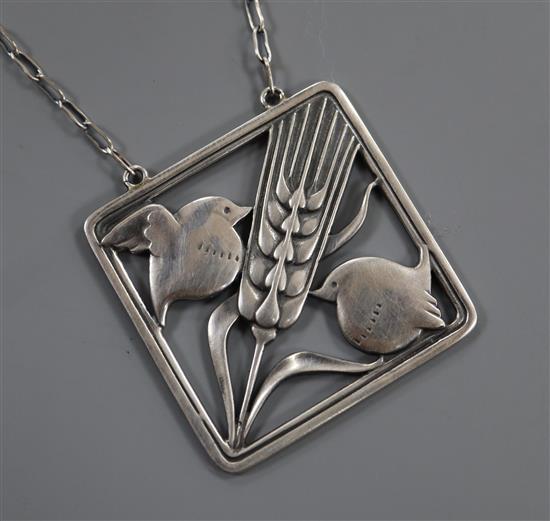 A Georg Jensen sterling wheatsheaf flanked by robins square pendant, no. 93, on a fine link chain, 36mm.